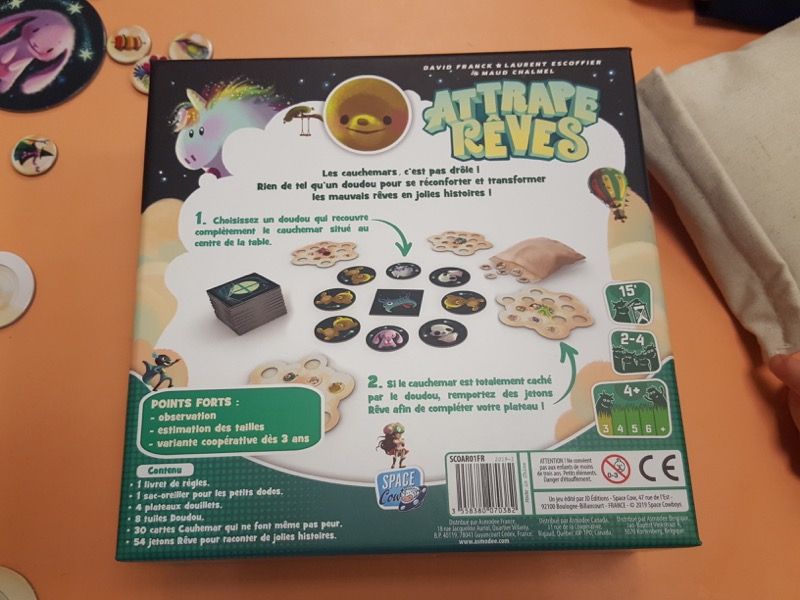 Le dos de la boite où on peut avoir une vue d'ensemble du matériel et de la mise en place du jeu.