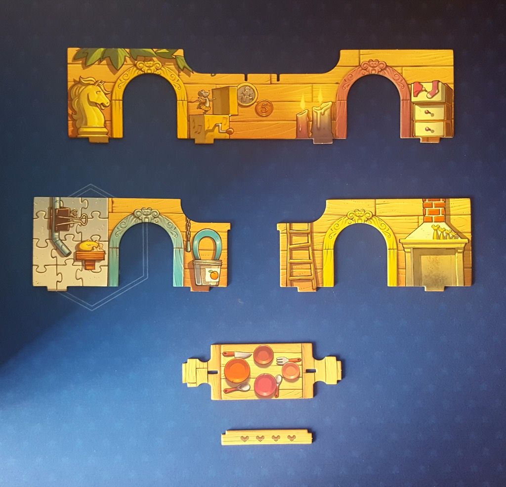 Le grand mur central et les 2 petits murs latéraux  avec une table à manger le tout en carton bien épais.