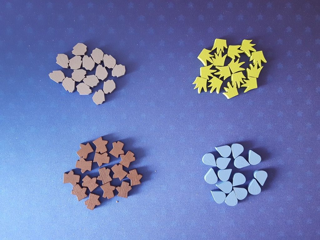 15 pions Pierre, 15 pions Plantes, 15 pions Bois et 15 pions Eau.