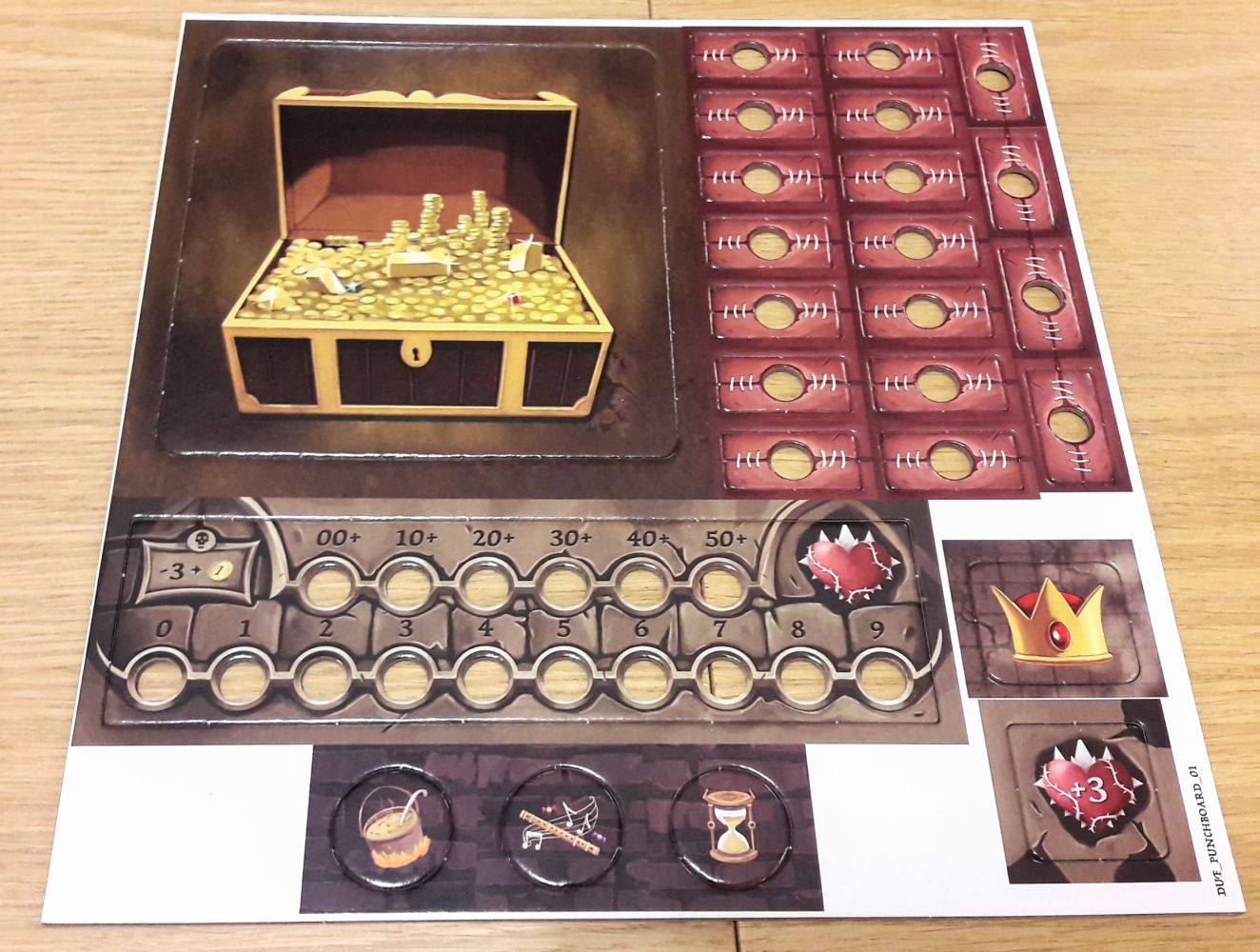 Quelques jetons, un plateau butin et un plateau compteur de vie du monstre.