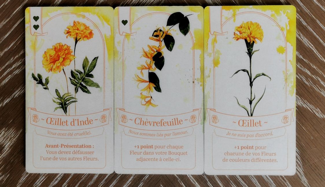 Le mal aimé Œillet d’Inde qui vous donne 2 points ♥ mais vous fait perdre 1 tuile. et le très recherché Œillet qui peut facilement rapporter jusqu'à 4 points.