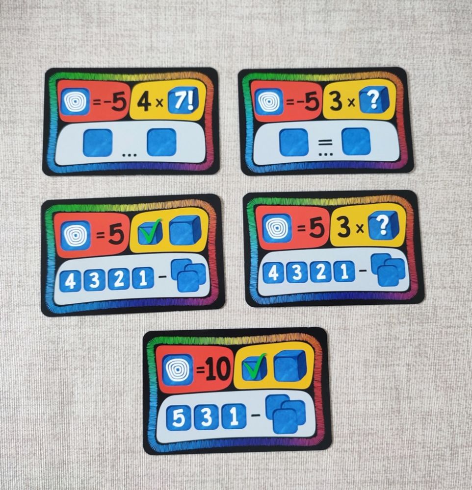 Il y a 5 cartes Défi où la couleur rouge indique que le tourbillon a une valeur négative (égale au chiffre indiqué).  Alors là on peut voir des 5 et des -5... une anomalie ?