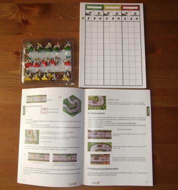 Le livret des règles, un bloc de feuillets, des coureurs