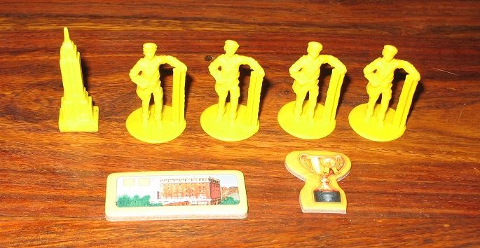 En plus des gratte-ciels chaque joueur a également 1 pion marqueur (gratte-ciel), 4 ouvriers, 1 bâtiment de départ et un jeton King.